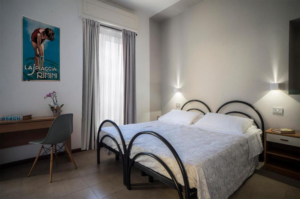 Postel nebo postele na pokoji v ubytování Hotel Mon Pays