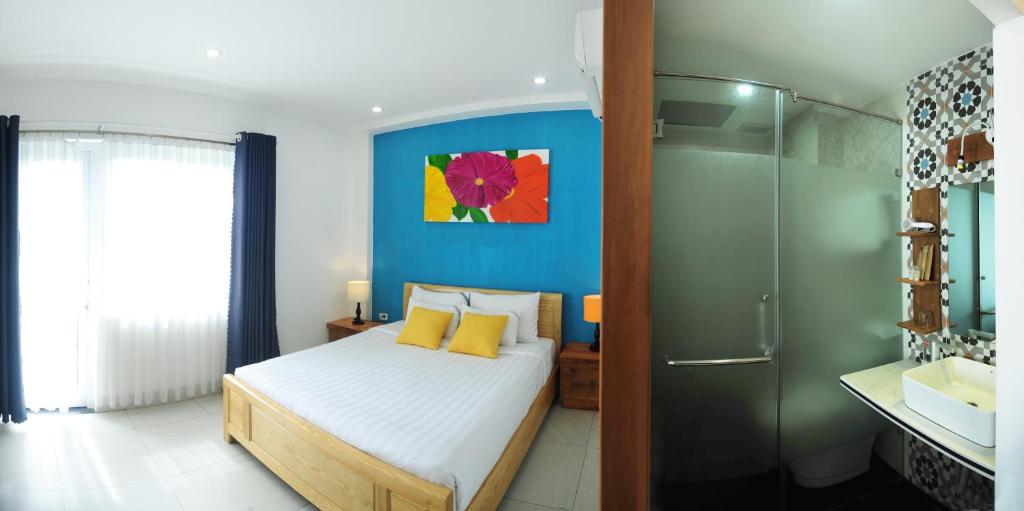 Postel nebo postele na pokoji v ubytování Cavilla Boutique Hotel & Apartment Da Nang