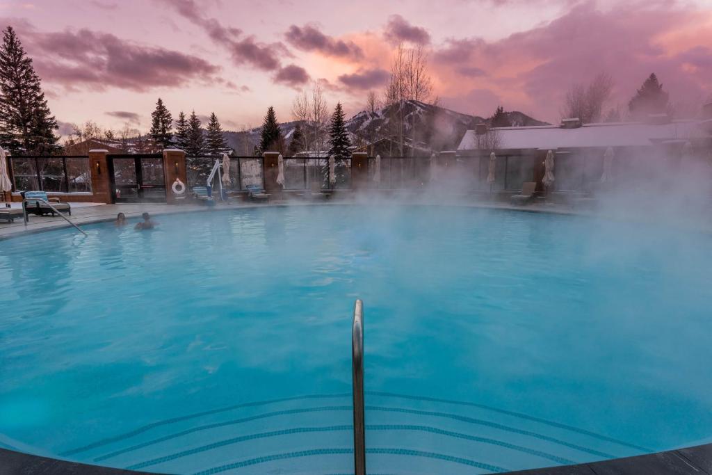 a large blue pool with steam coming out of it at Dollar Meadows in Sun Valley