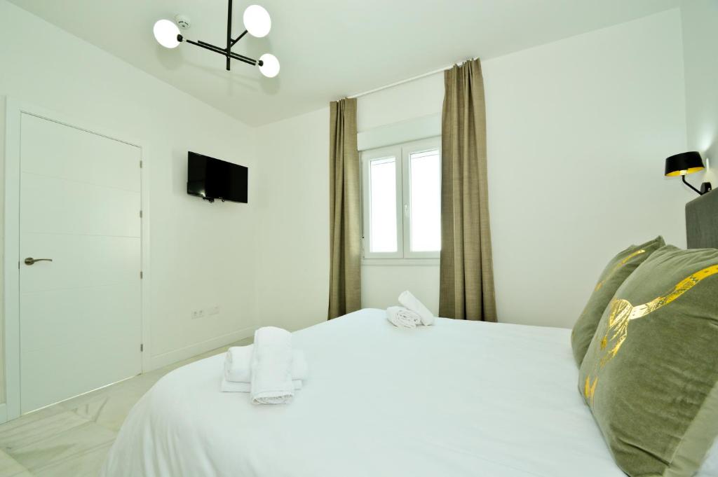 Posteľ alebo postele v izbe v ubytovaní NineSuites