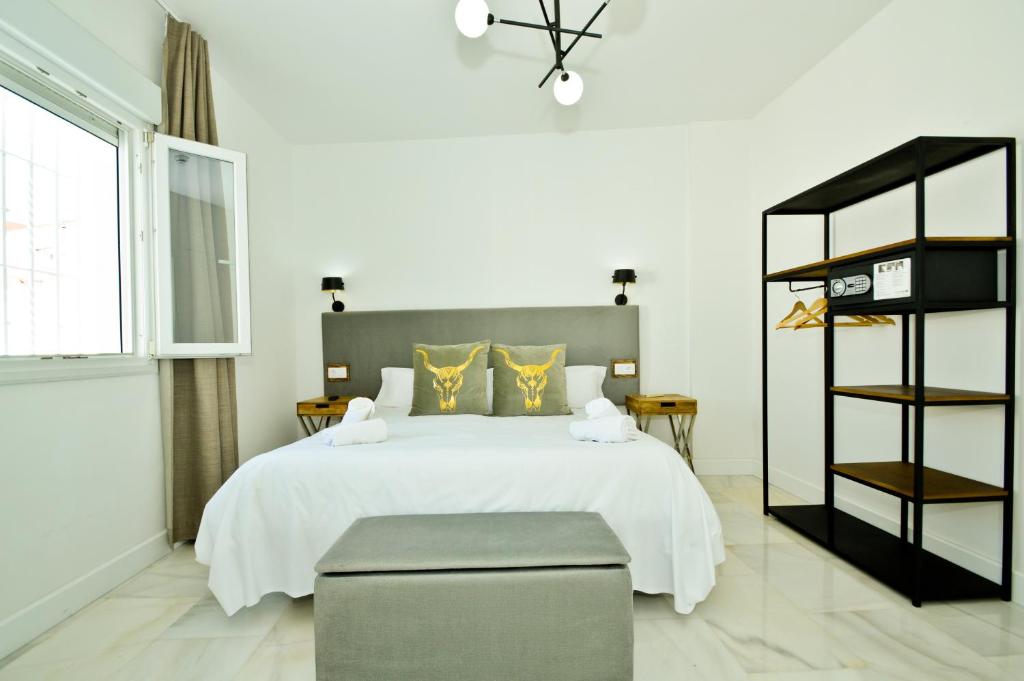 Posteľ alebo postele v izbe v ubytovaní NineSuites