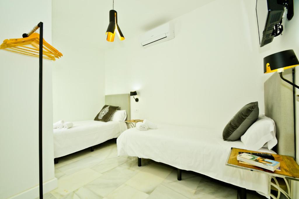 Posteľ alebo postele v izbe v ubytovaní NineSuites
