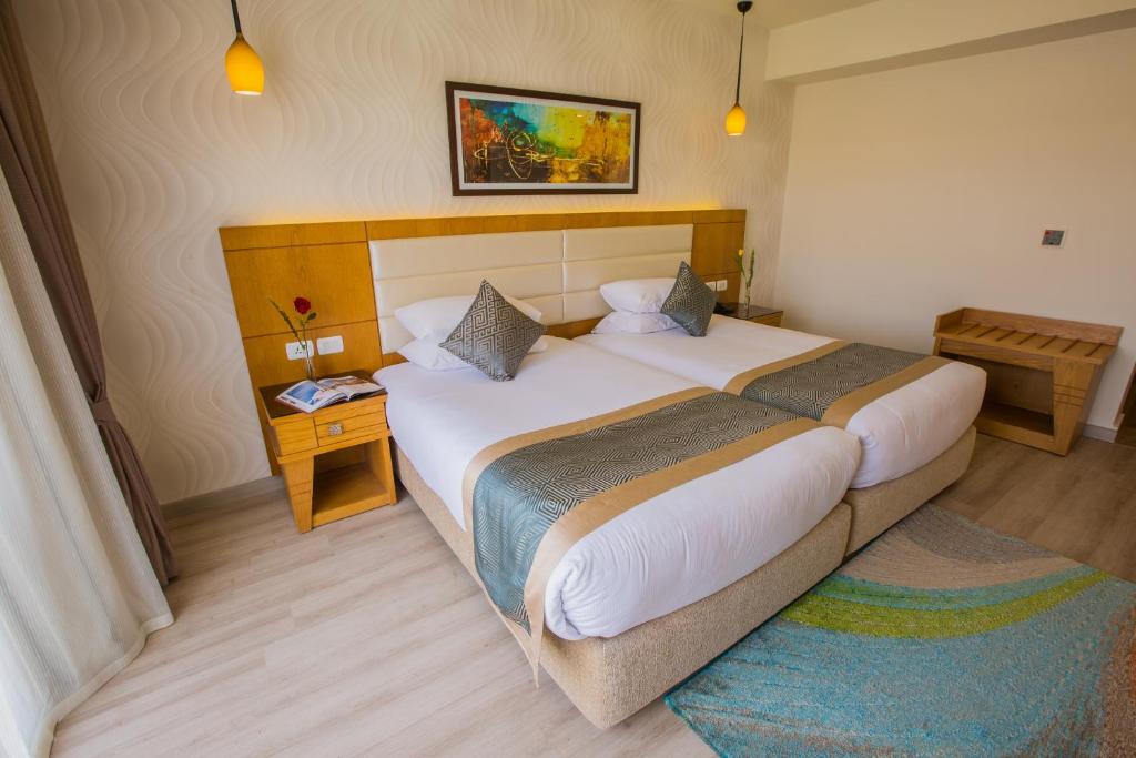 Letto o letti in una camera di Pickalbatros Aqua Blu Sharm El Sheikh