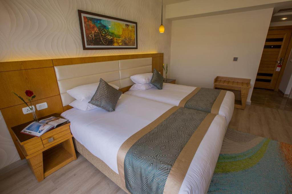 Letto o letti in una camera di Pickalbatros Aqua Blu Sharm El Sheikh
