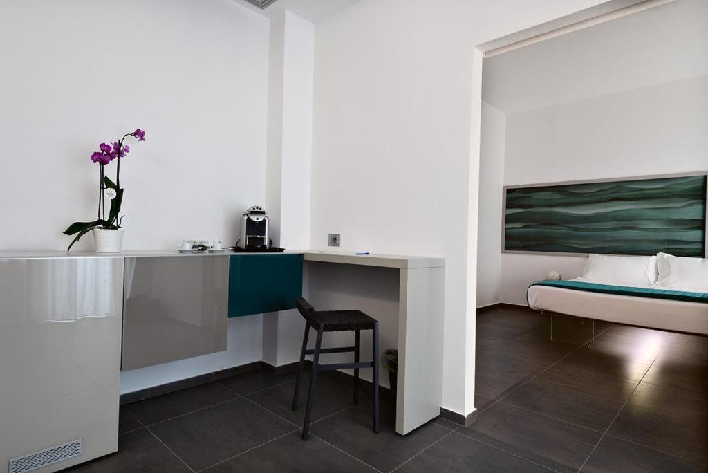 Postel nebo postele na pokoji v ubytování nautilus b&b suite design