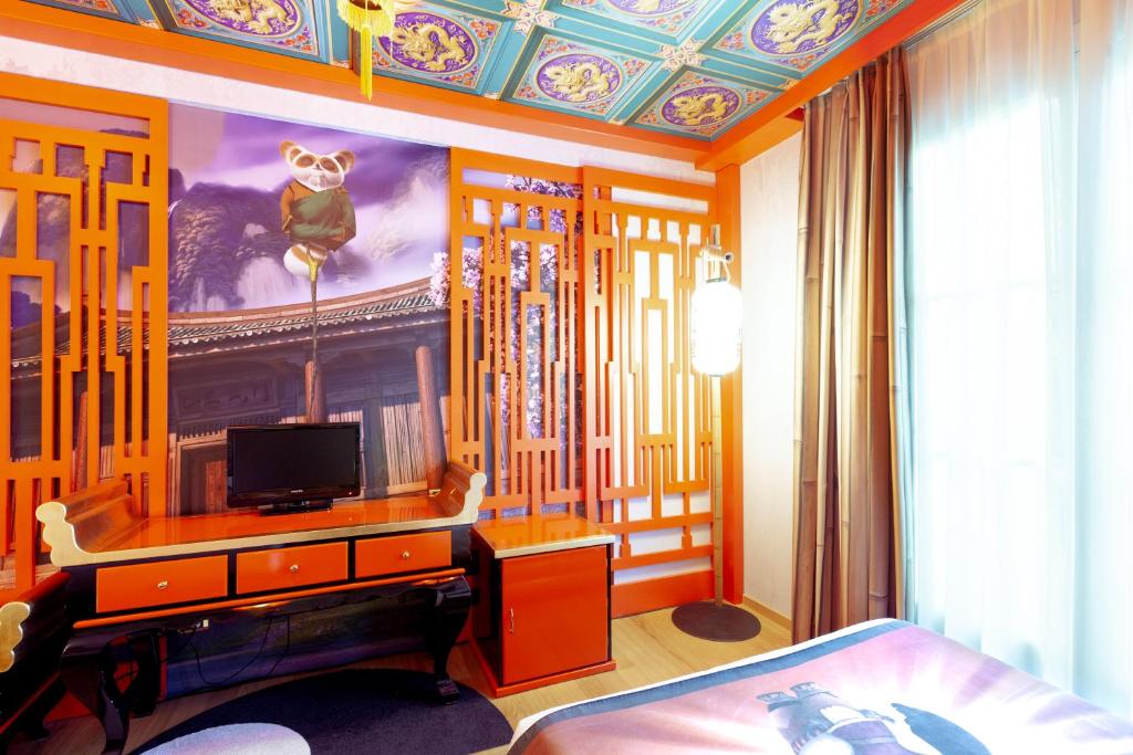 TV a/nebo společenská místnost v ubytování Gardaland Hotel