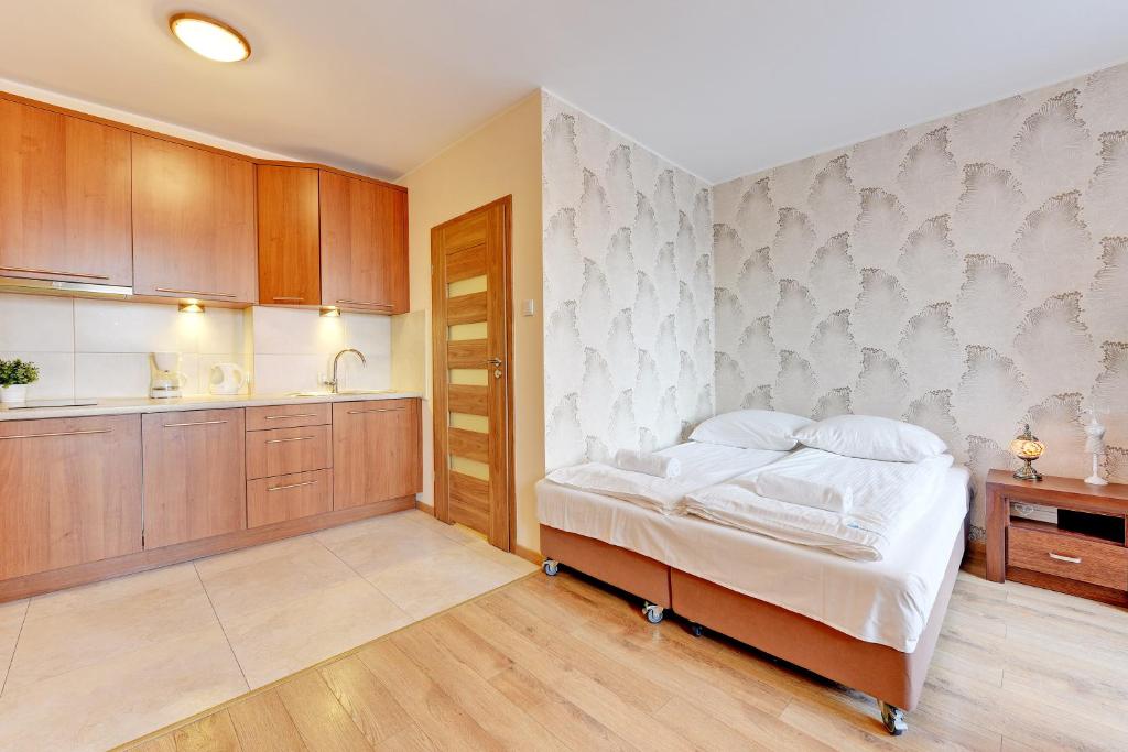 Posteľ alebo postele v izbe v ubytovaní Aura Apartments Old Town