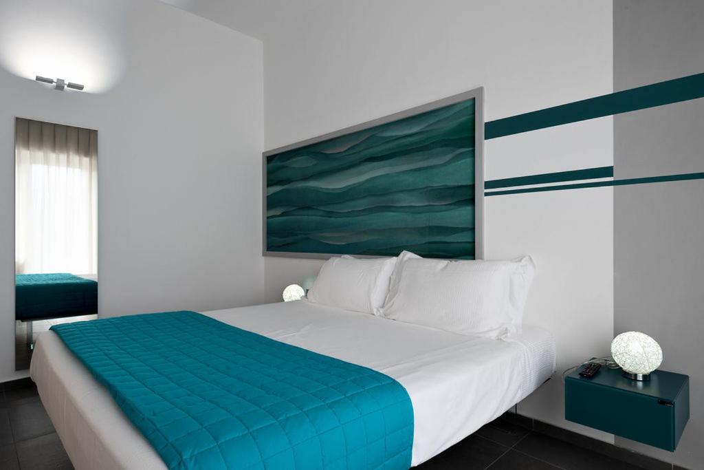 Postel nebo postele na pokoji v ubytování nautilus b&b suite design