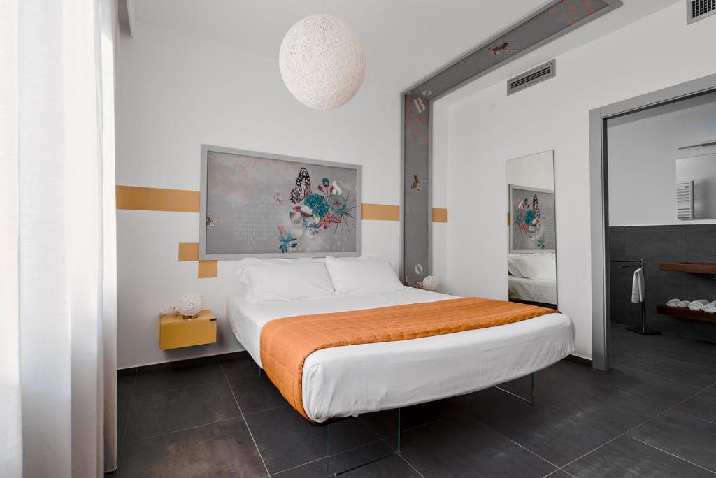 Postel nebo postele na pokoji v ubytování nautilus b&b suite design