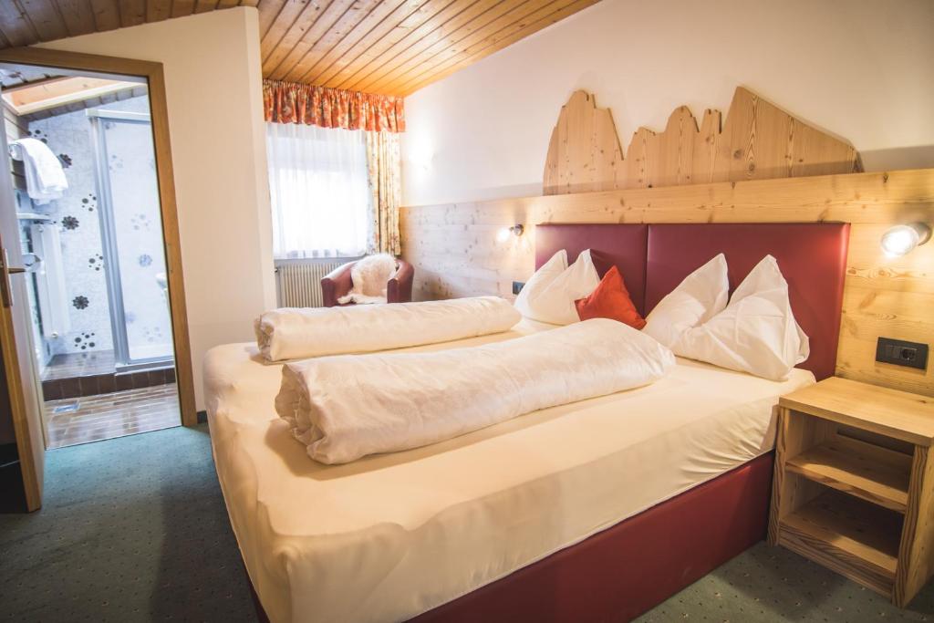 Posteľ alebo postele v izbe v ubytovaní Residence Sisi