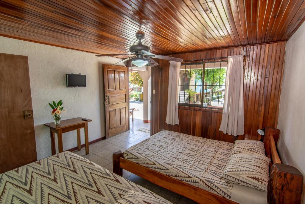Postel nebo postele na pokoji v ubytování Cabinas Arrecife