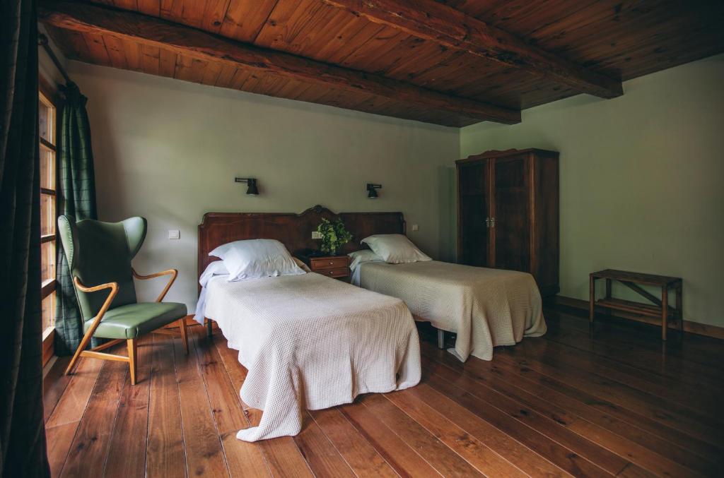 Postel nebo postele na pokoji v ubytování Hotel Caldas