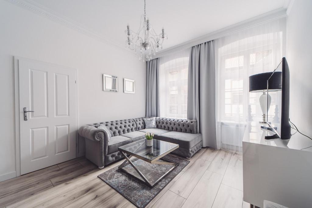 Telewizja i/lub zestaw kina domowego w obiekcie Glam Apartments