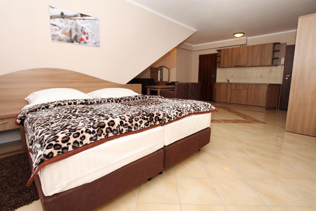 Posteľ alebo postele v izbe v ubytovaní Apartamenty Rok