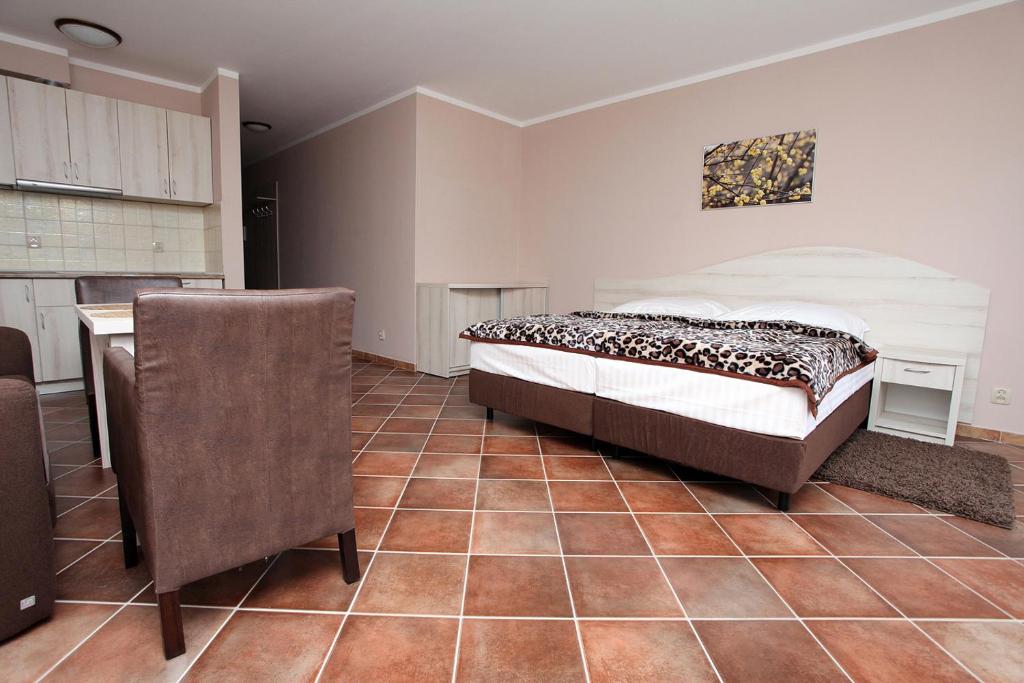 Posteľ alebo postele v izbe v ubytovaní Apartamenty Rok