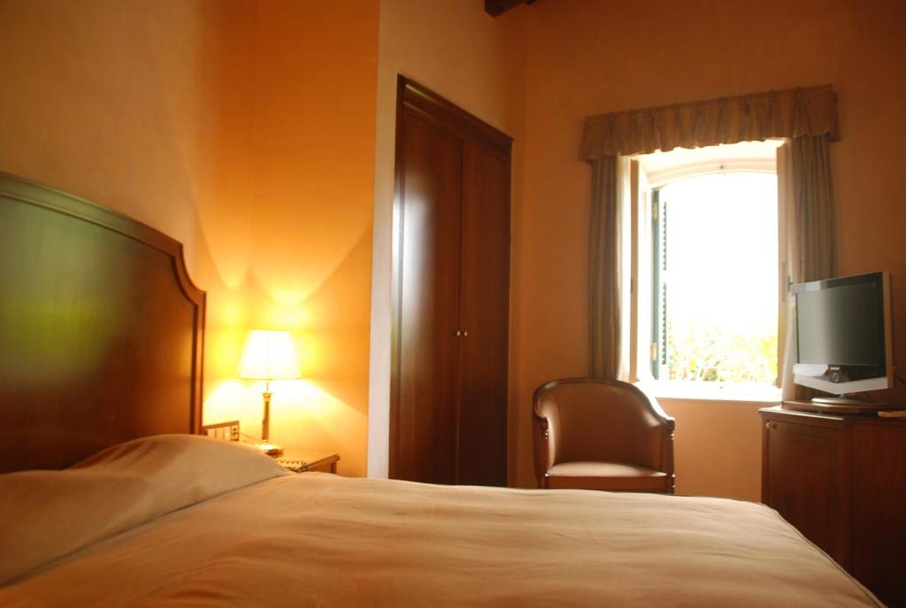 Postel nebo postele na pokoji v ubytování Siora Vittoria Boutique Hotel