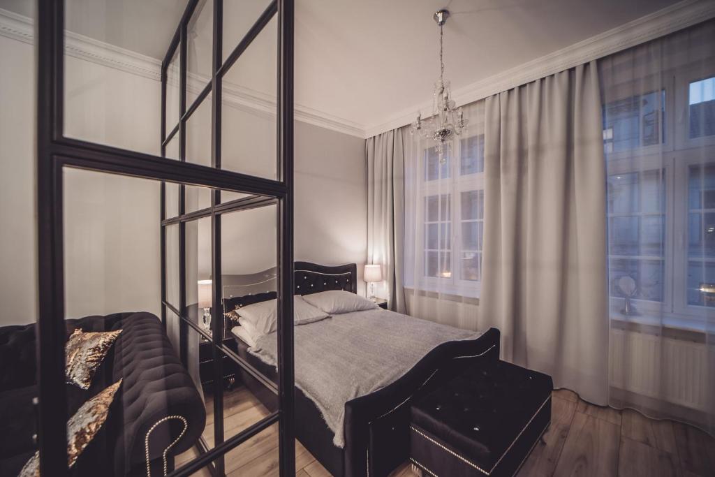 Łóżko lub łóżka w pokoju w obiekcie Glam Apartments