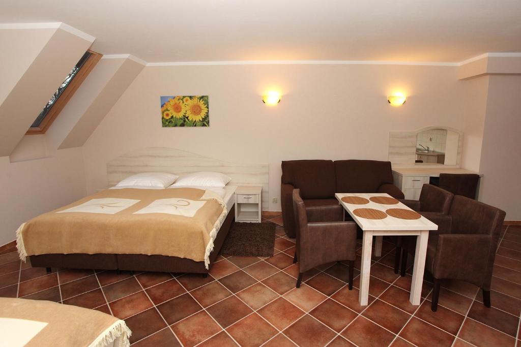 Posteľ alebo postele v izbe v ubytovaní Apartamenty Rok