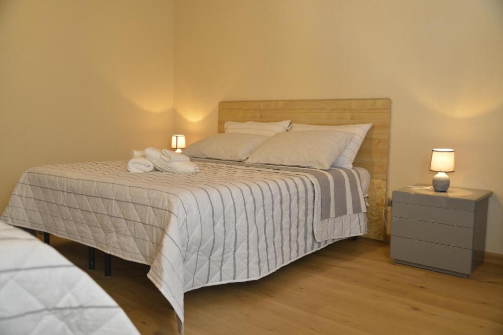 Postel nebo postele na pokoji v ubytování Agriturismo Ai Prüsot