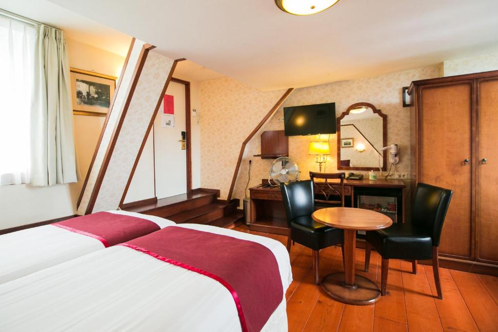 Postel nebo postele na pokoji v ubytování Hotel Atlanta