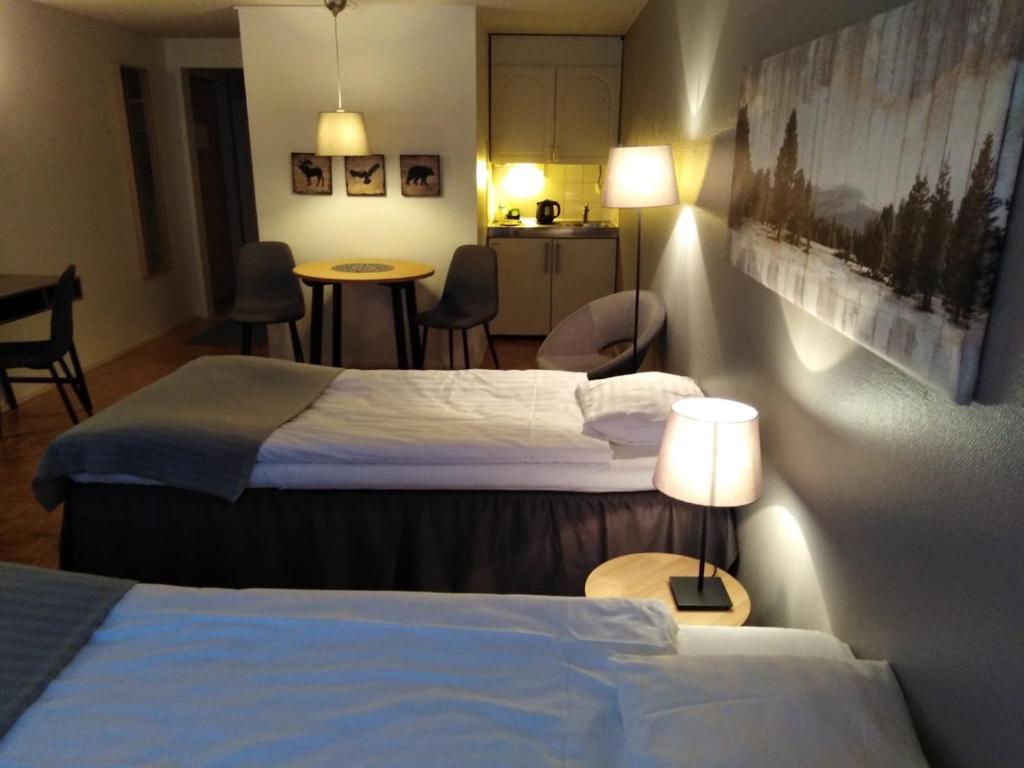Postel nebo postele na pokoji v ubytování Hotel Yöpuu
