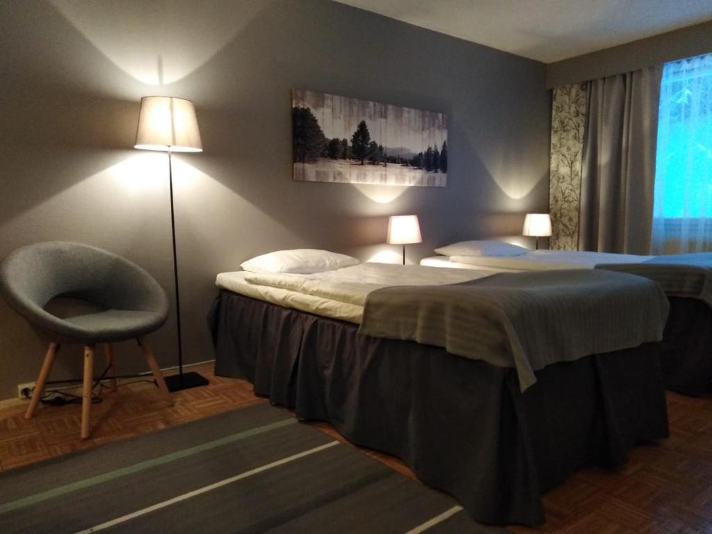 Postel nebo postele na pokoji v ubytování Hotel Yöpuu
