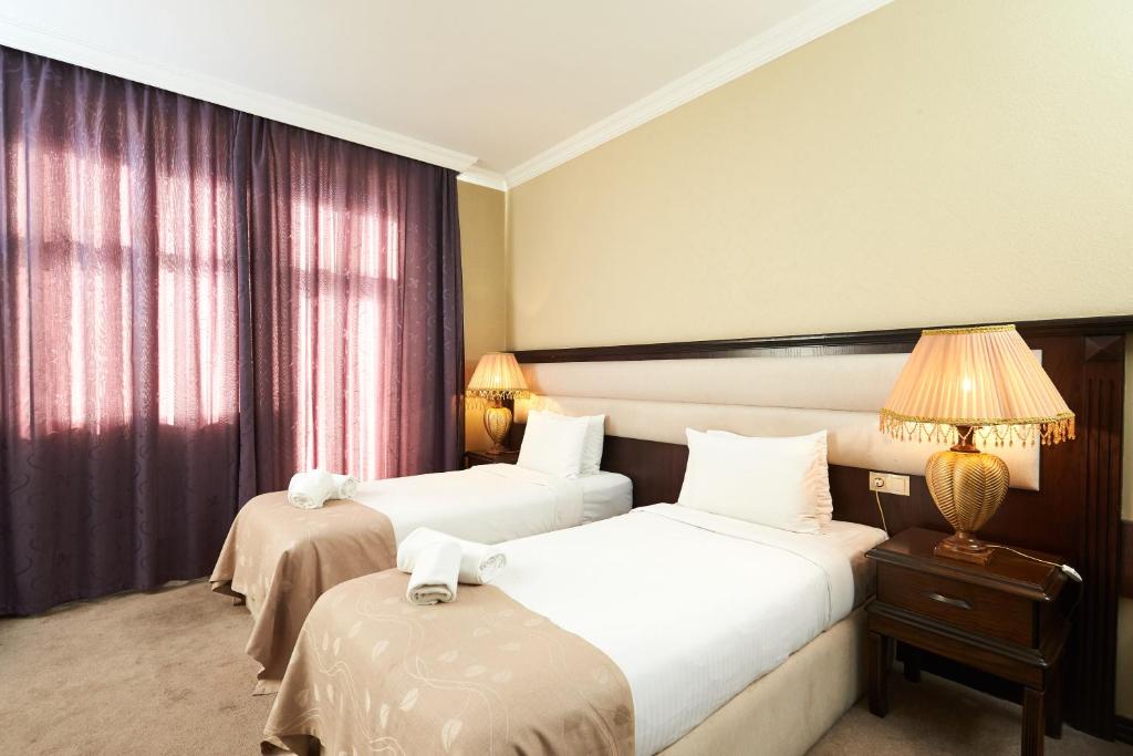 Postel nebo postele na pokoji v ubytování Smith Hotel