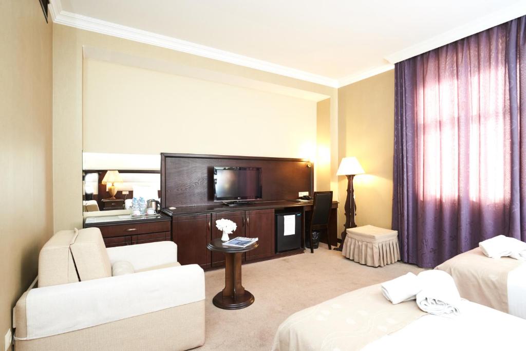 Postel nebo postele na pokoji v ubytování Smith Hotel