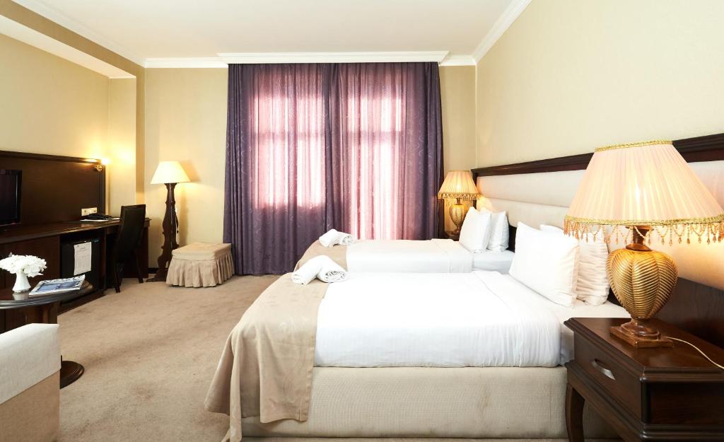 Postel nebo postele na pokoji v ubytování Smith Hotel