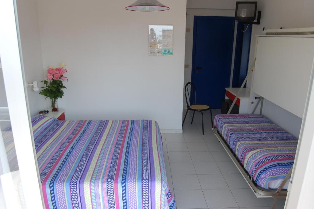 Posteľ alebo postele v izbe v ubytovaní Hotel Wally