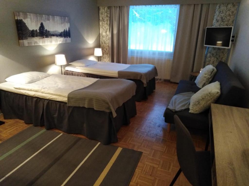 Postel nebo postele na pokoji v ubytování Hotel Yöpuu
