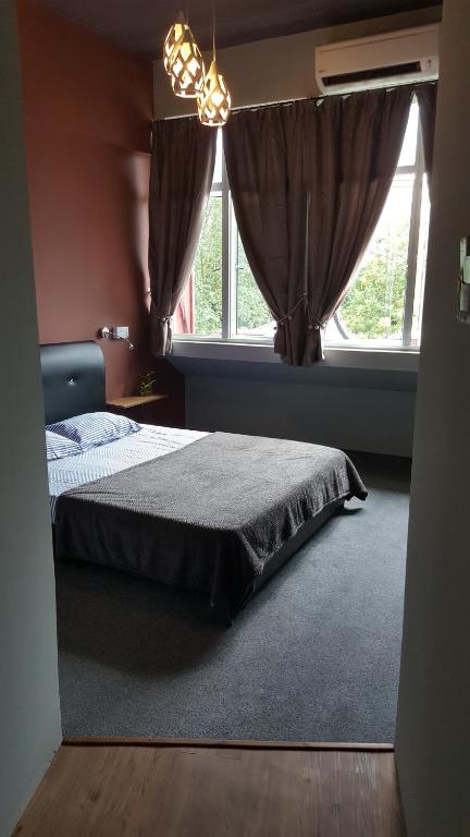 Postel nebo postele na pokoji v ubytování Borneo Sweet Guesthouse