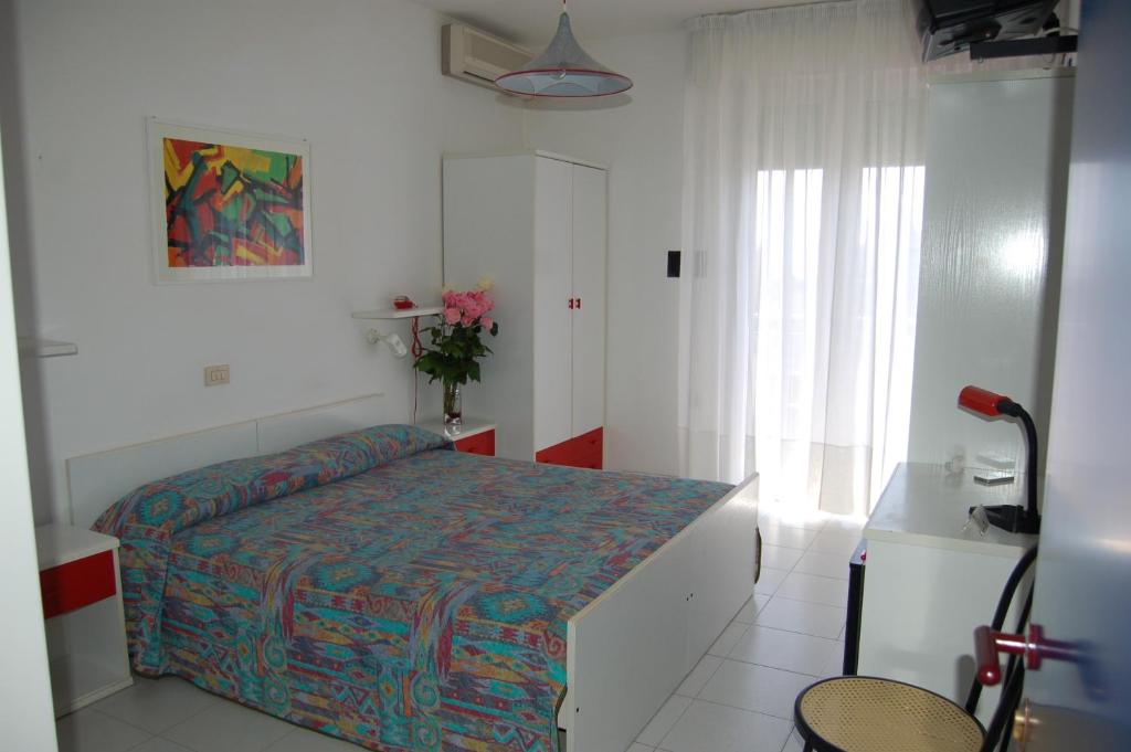 Posteľ alebo postele v izbe v ubytovaní Hotel Wally