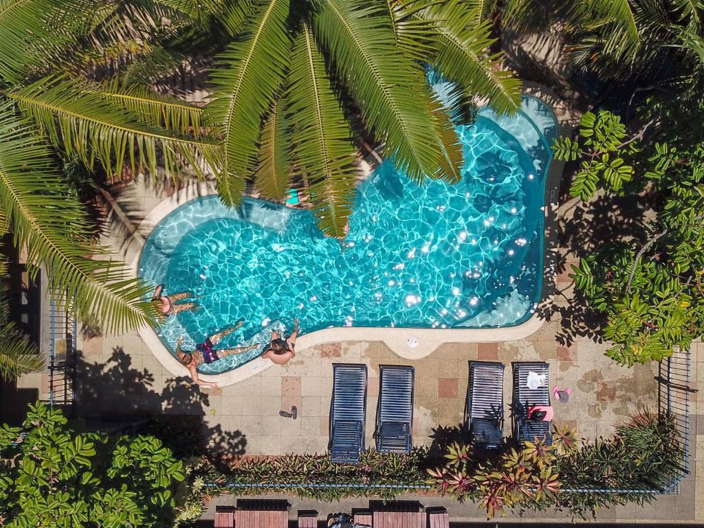 an overhead view of a swimming pool in a resort at YHA Cairns Central in Cairns