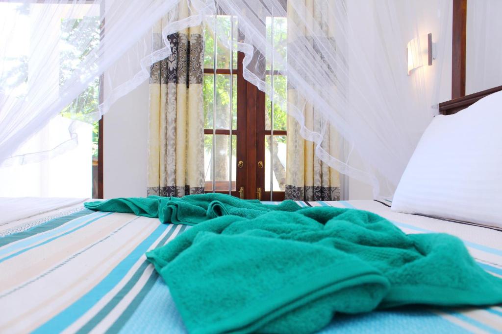 Ένα ή περισσότερα κρεβάτια σε δωμάτιο στο Milanka Guest