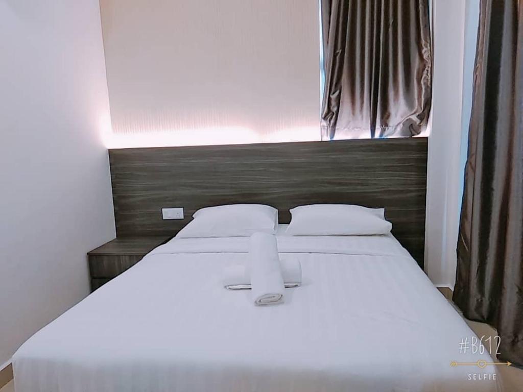 Postel nebo postele na pokoji v ubytování KU-3 HOTEL