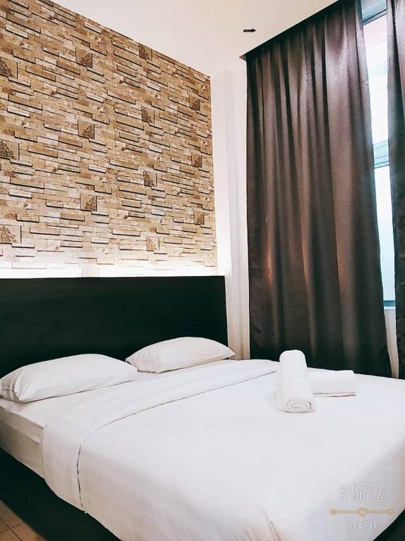 Postel nebo postele na pokoji v ubytování KU-3 HOTEL