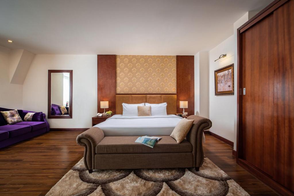 Postel nebo postele na pokoji v ubytování Nesta Hotel Hanoi