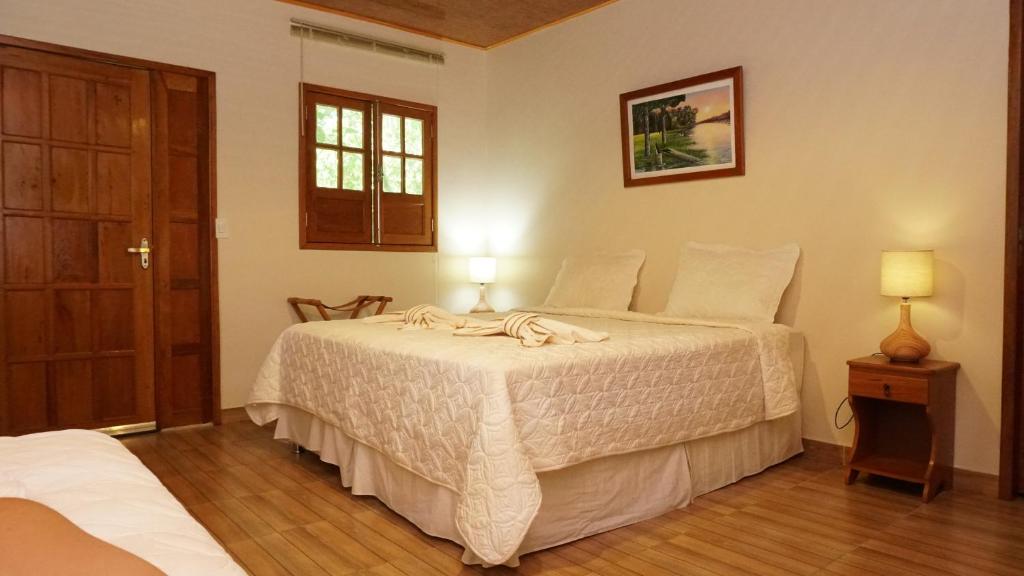 Voodi või voodid majutusasutuse Evolução Ecolodge toas