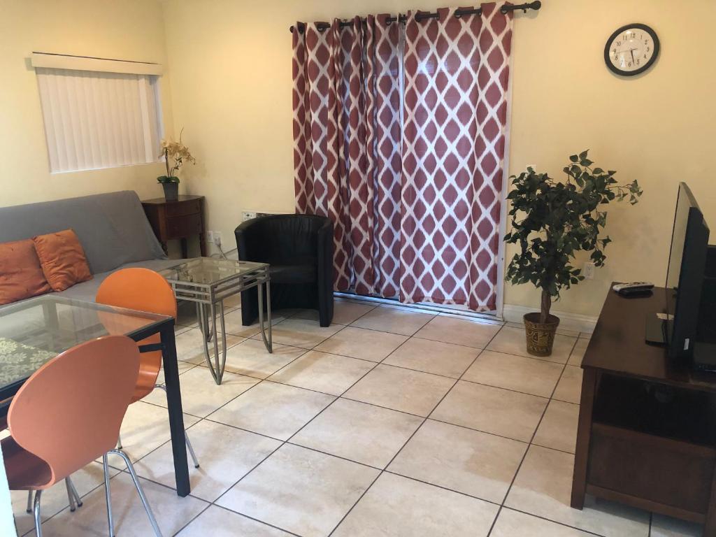 a living room with a couch and a table at Beautiful New Home in Burbank 1bd in Burbank