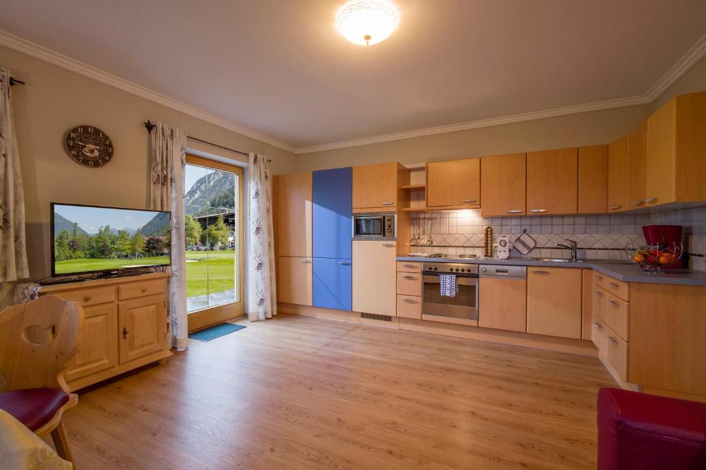 Kuchyň nebo kuchyňský kout v ubytování Appartements Fortuna