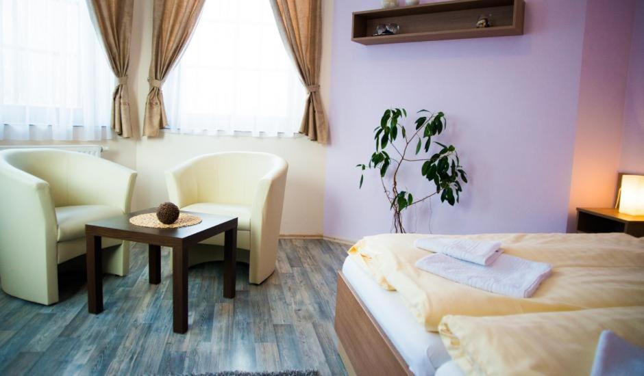 Postel nebo postele na pokoji v ubytování Penzion - Restaurace Na Mýtě