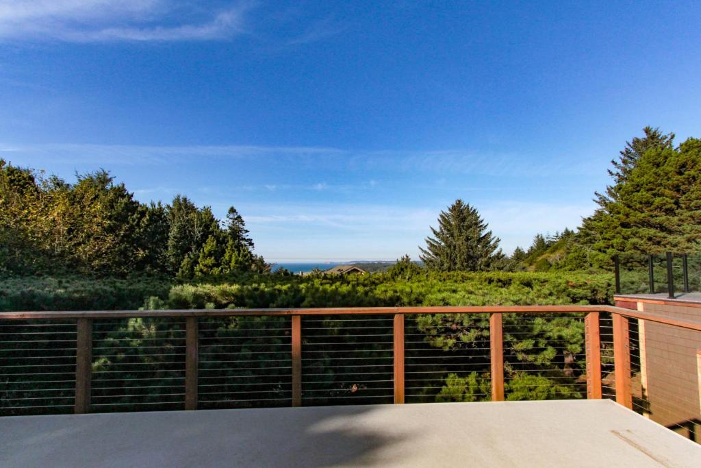 a view from the balcony of a house at Singing Winds in Port Orford