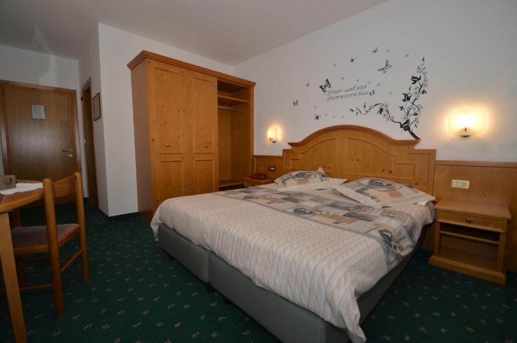 Postel nebo postele na pokoji v ubytování Hotel Albe