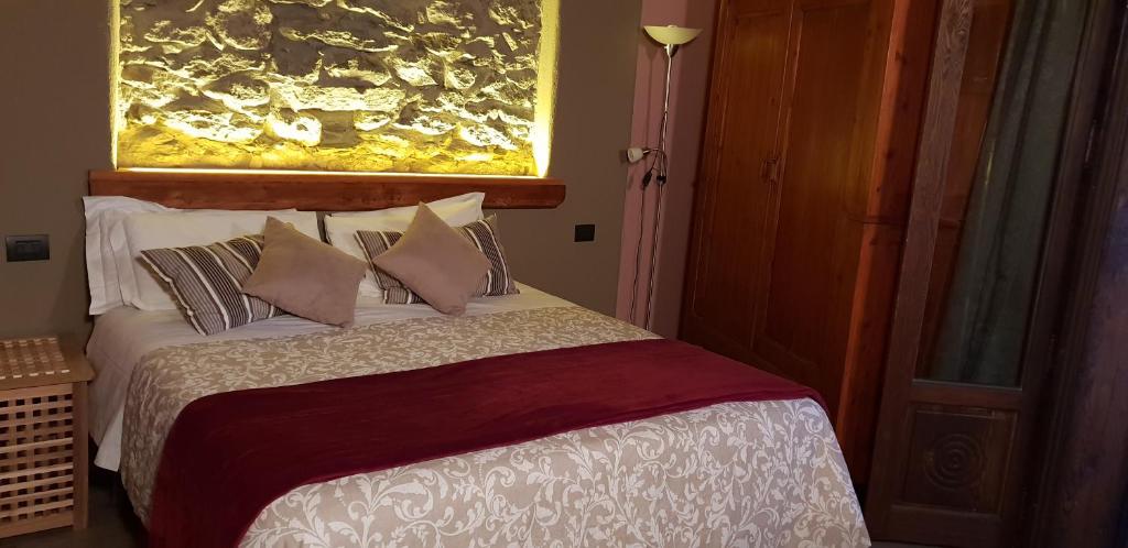 Postel nebo postele na pokoji v ubytování Agriturismo Rivet d'Or