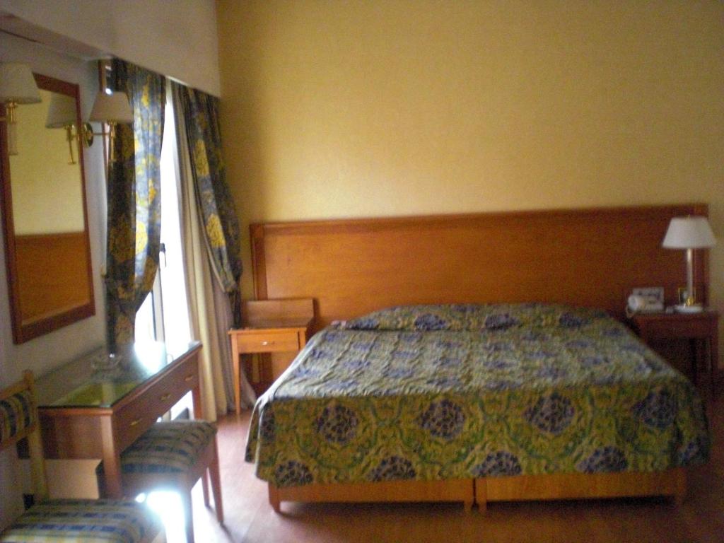 Postel nebo postele na pokoji v ubytování Philippe Luxor Hotel