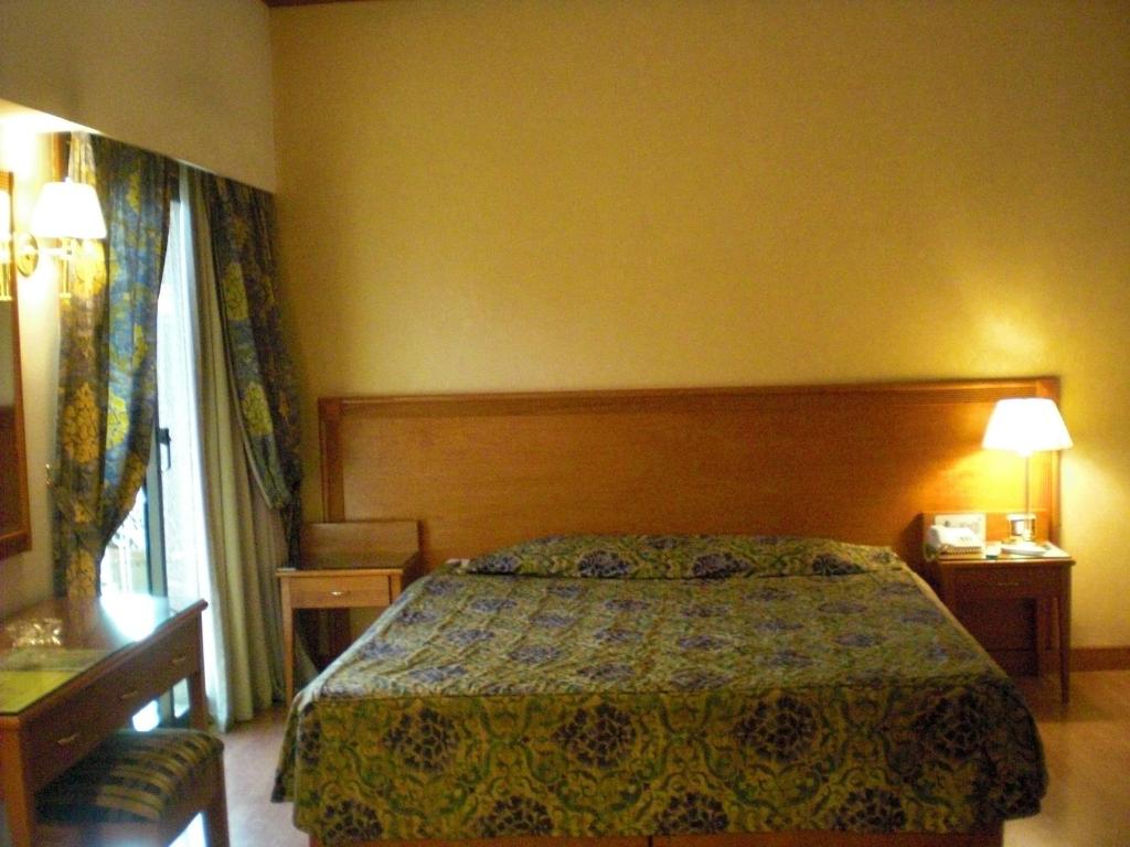 Postel nebo postele na pokoji v ubytování Philippe Luxor Hotel