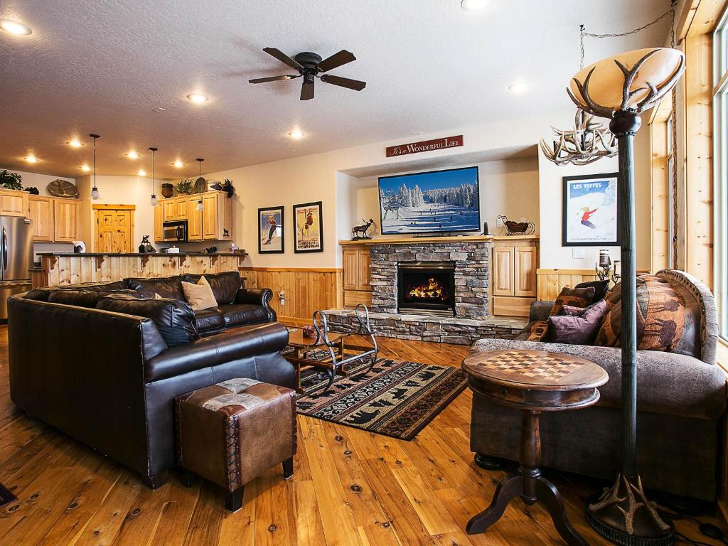 a living room with a couch and a fireplace at Crystal Springs Chalet in Sandpoint