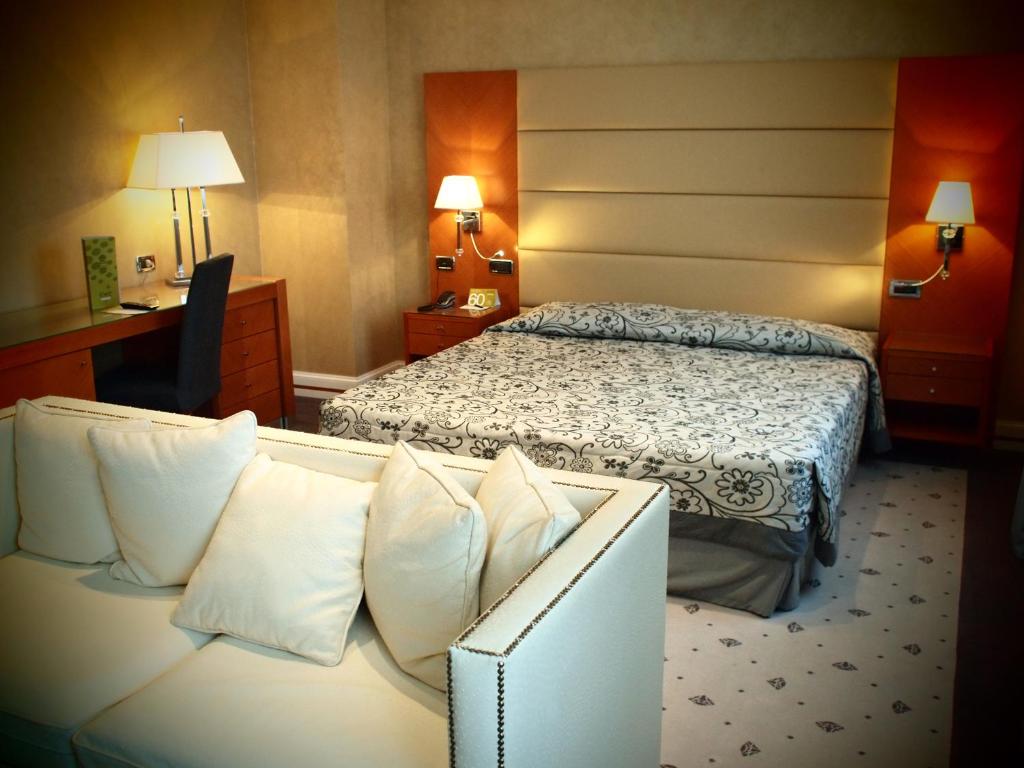 Postel nebo postele na pokoji v ubytování Hotel Perusia