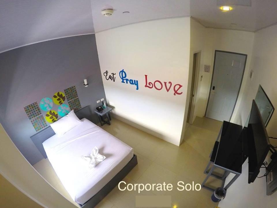 Postel nebo postele na pokoji v ubytování GC Suites